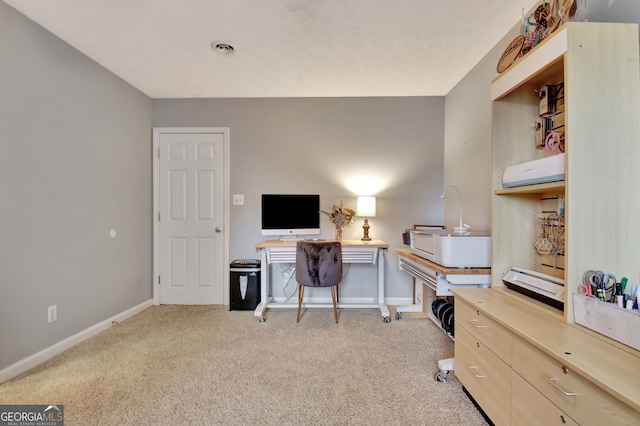 office area featuring light colored carpet