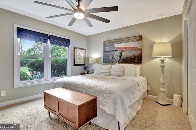 carpeted bedroom with ceiling fan