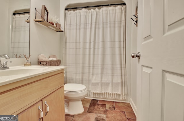 bathroom with vanity, toilet, and a shower with shower curtain