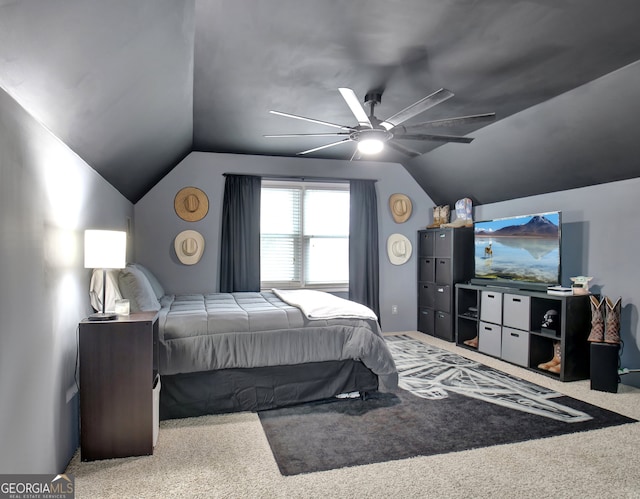 bedroom featuring carpet floors, lofted ceiling, and ceiling fan