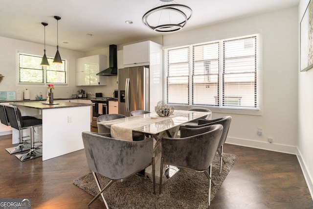 dining space featuring dark hardwood / wood-style flooring