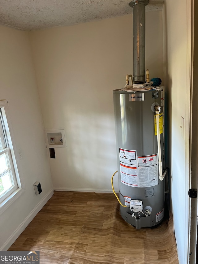 utility room with gas water heater