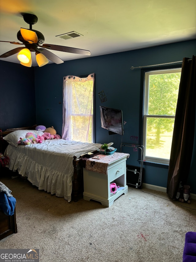 carpeted bedroom with ceiling fan