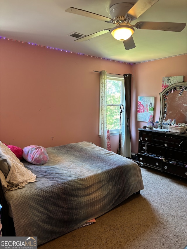 carpeted bedroom with ceiling fan