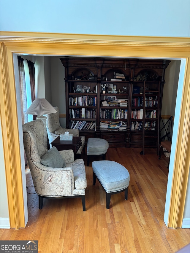 sitting room with hardwood / wood-style floors