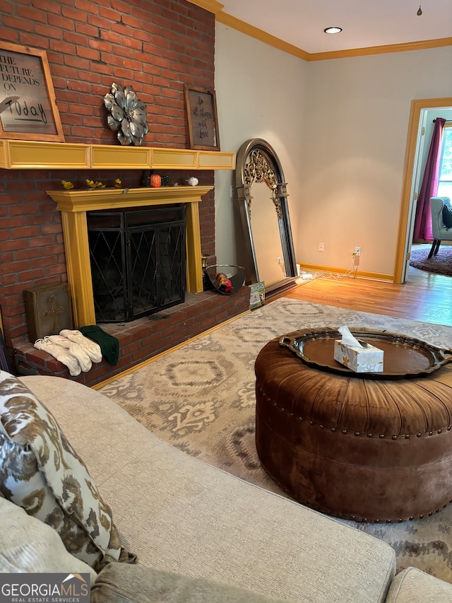 living room with ornamental molding and a fireplace