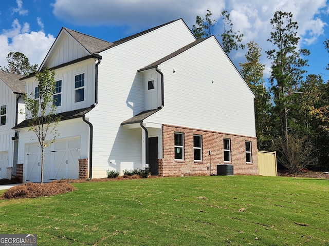 view of property exterior with a yard and a garage