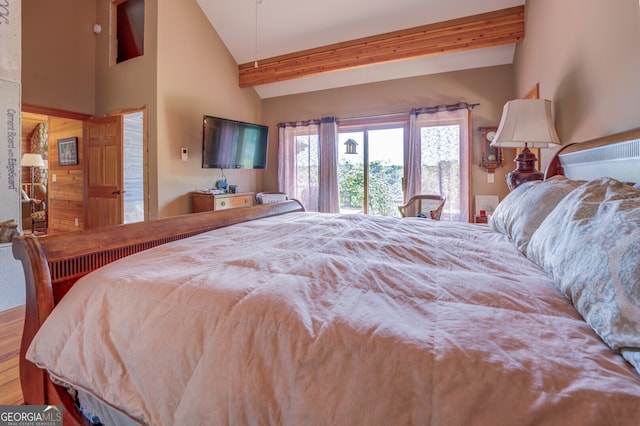 bedroom featuring wood-type flooring, beamed ceiling, and high vaulted ceiling