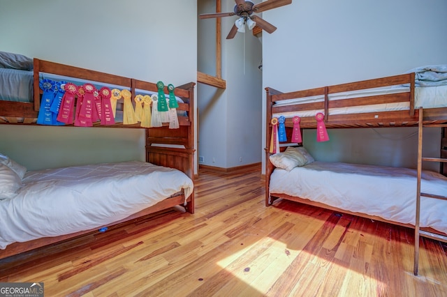 bedroom with ceiling fan and light hardwood / wood-style floors