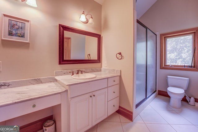 bathroom featuring tile patterned flooring, an enclosed shower, vanity, and toilet