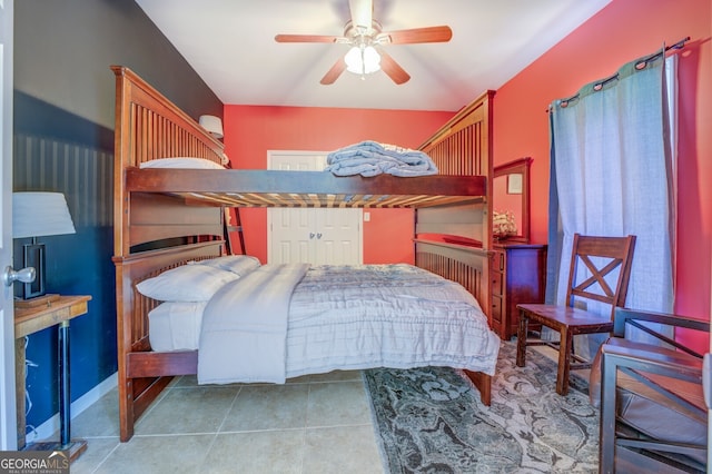 bedroom with ceiling fan and light tile patterned floors