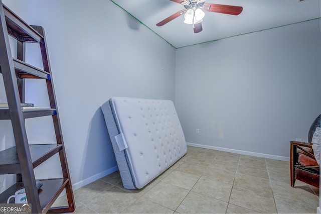 unfurnished room featuring ceiling fan and light tile patterned floors