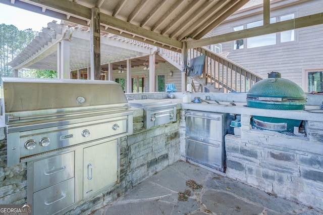 view of patio featuring exterior kitchen