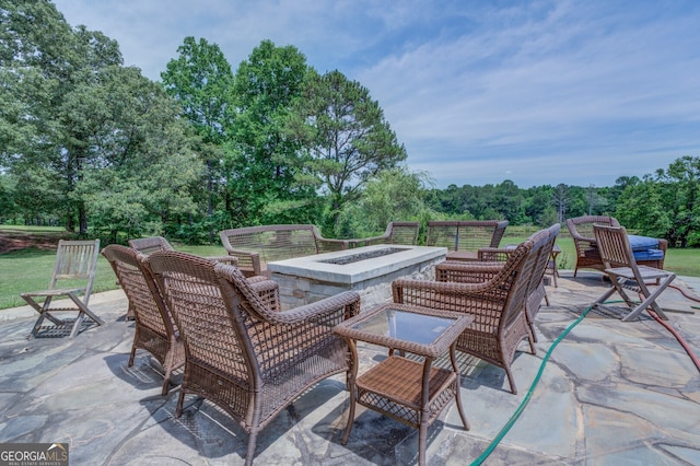 view of patio with an outdoor fire pit