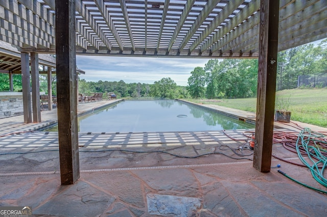 view of swimming pool featuring a patio, a pergola, and a water view