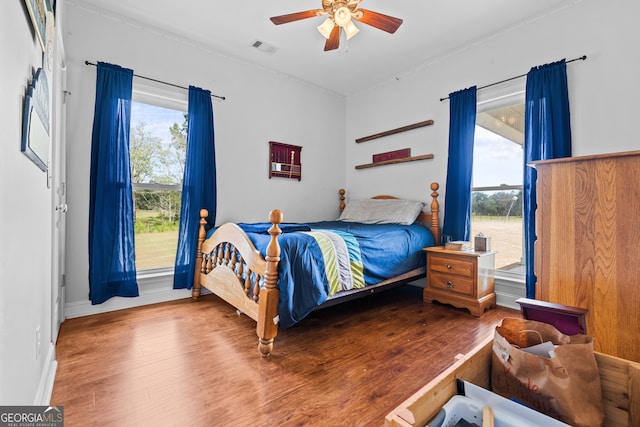 bedroom featuring ceiling fan and wood-type flooring