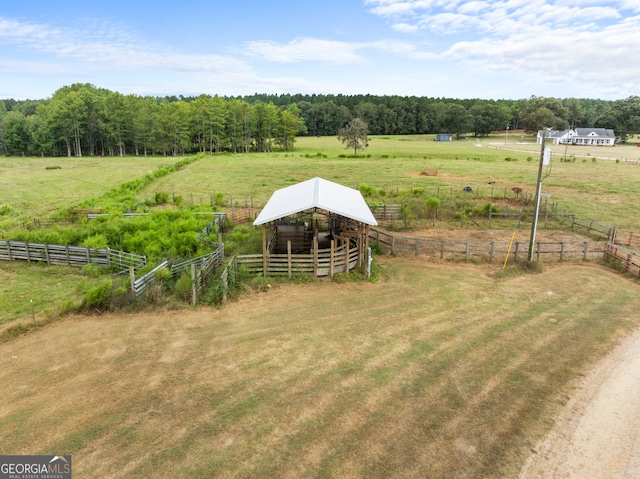 birds eye view of property featuring a rural view