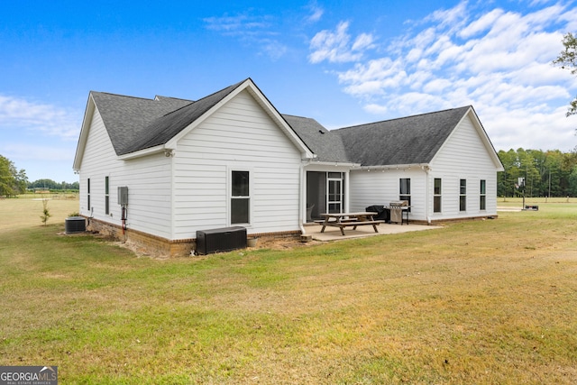 back of house featuring a yard and a patio area