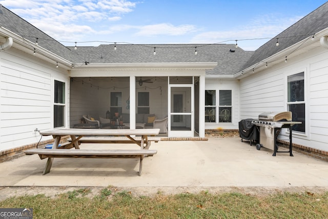 rear view of house with a patio, a sunroom, and ceiling fan