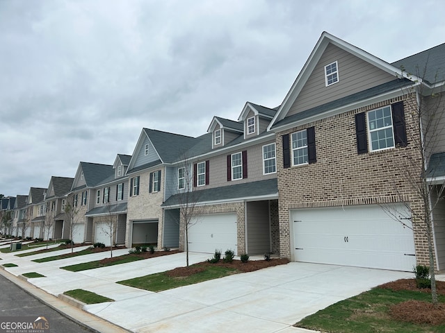 multi unit property featuring a garage