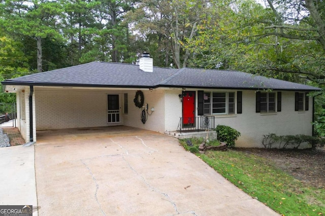 single story home featuring a carport