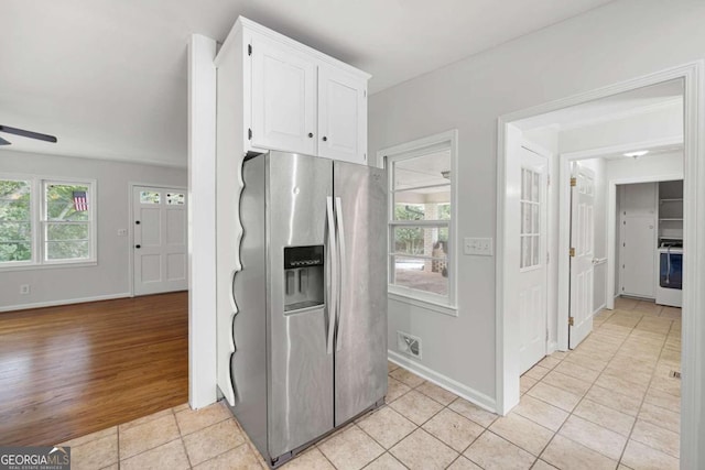 kitchen with ceiling fan, light hardwood / wood-style flooring, stainless steel fridge with ice dispenser, white cabinetry, and white range oven