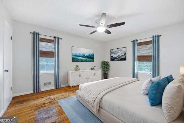 bedroom featuring light wood-type flooring and ceiling fan