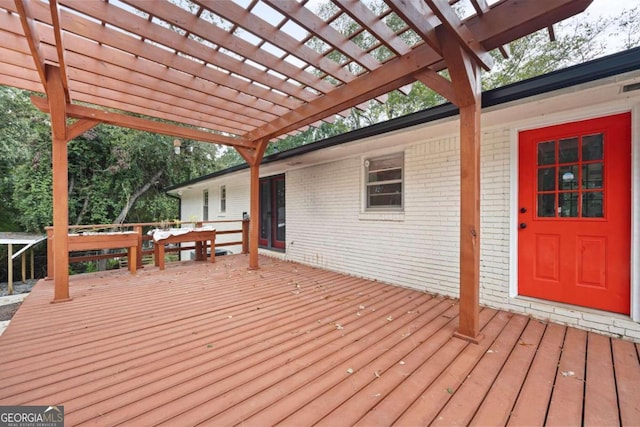 wooden deck featuring a pergola