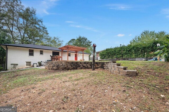 view of yard with a pergola