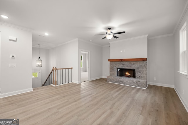 carpeted empty room featuring ornamental molding, a healthy amount of sunlight, and ceiling fan