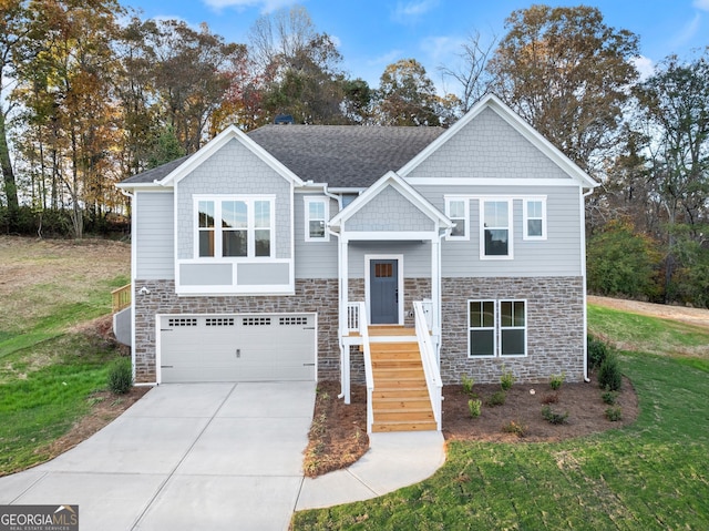 split foyer home featuring a front lawn and a garage