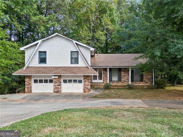 tri-level home featuring a front lawn and a garage