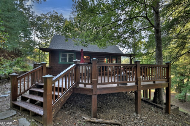 back of house featuring a deck