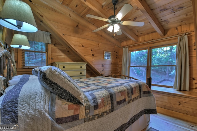 bedroom with wood ceiling, wooden walls, lofted ceiling with beams, and light hardwood / wood-style flooring