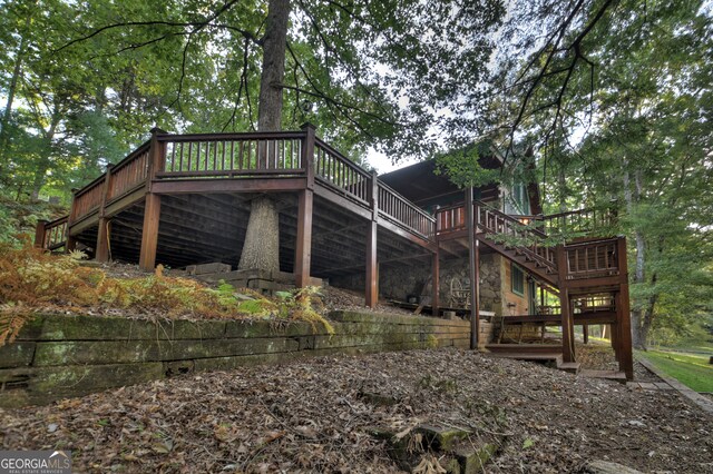 view of home's exterior with a wooden deck