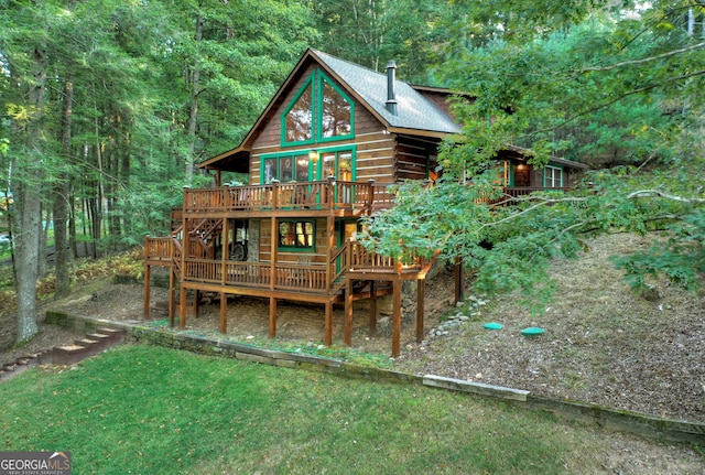 back of house with a wooden deck