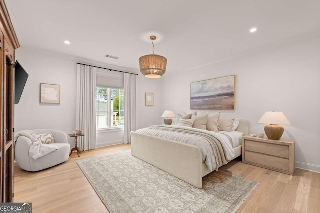 bedroom with light hardwood / wood-style flooring