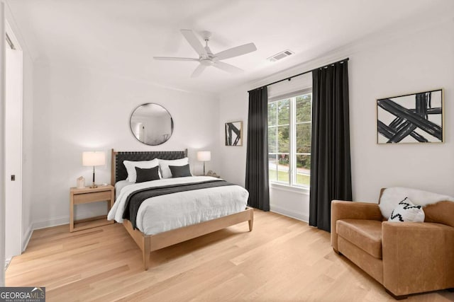 bedroom featuring ceiling fan and light hardwood / wood-style flooring