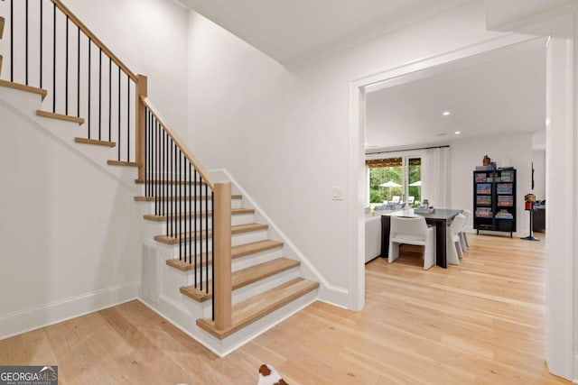 staircase featuring hardwood / wood-style floors