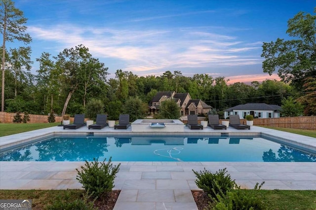 view of swimming pool with a patio