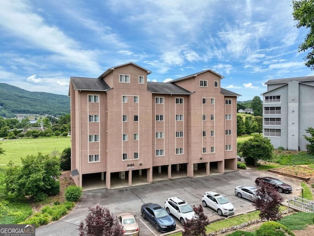 view of building exterior featuring a mountain view