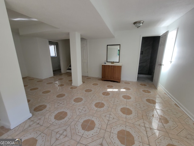 basement featuring light tile patterned floors