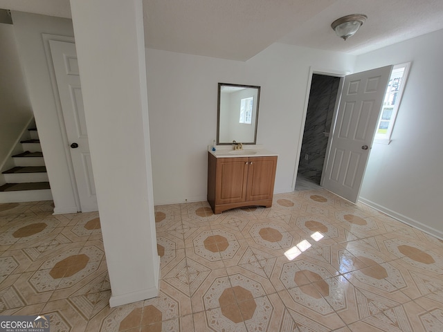 interior space featuring light tile patterned floors and sink