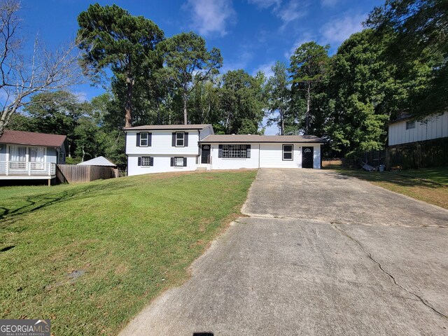 split level home with a front yard