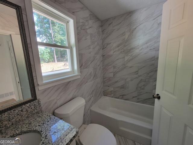 full bathroom with vanity, tile walls, toilet, and a wealth of natural light