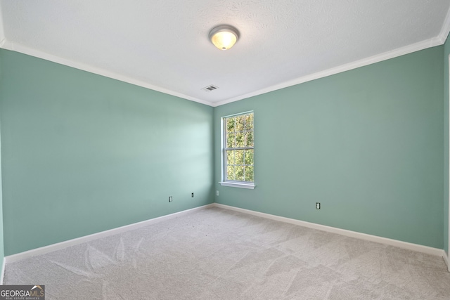 unfurnished room with a textured ceiling, light carpet, and crown molding