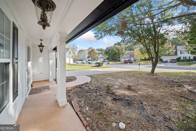 view of yard featuring covered porch