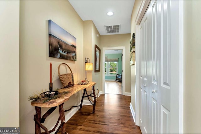 corridor with dark hardwood / wood-style floors