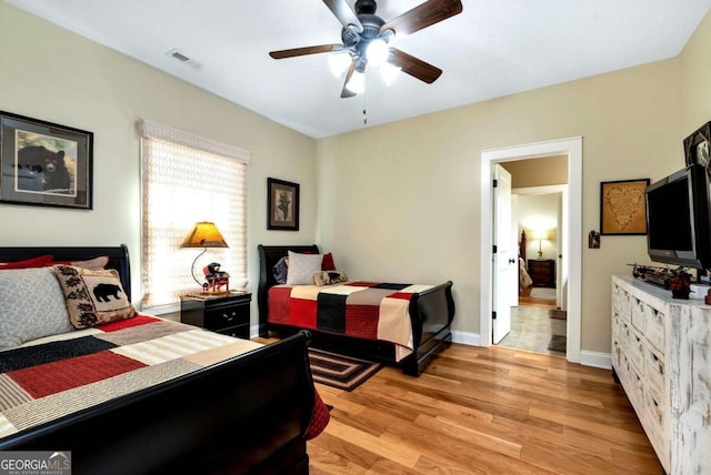 bedroom featuring light wood-type flooring and ceiling fan