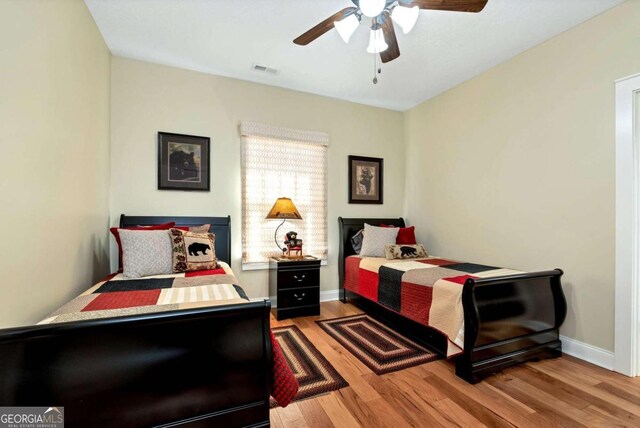 bedroom featuring light hardwood / wood-style flooring and ceiling fan